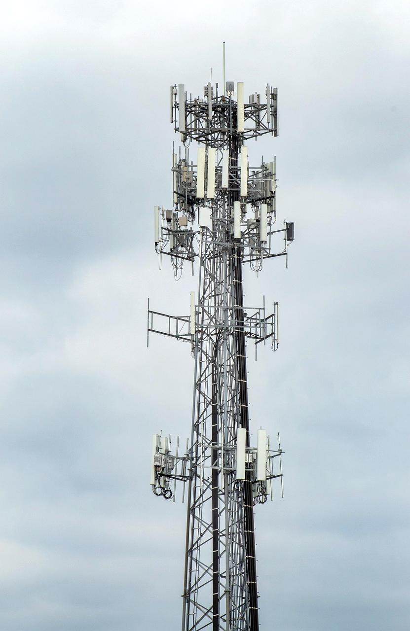 Cityscape with 5G network tower and mobile devices